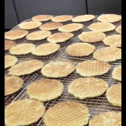 Pizzelle cookies cooling on wire racks