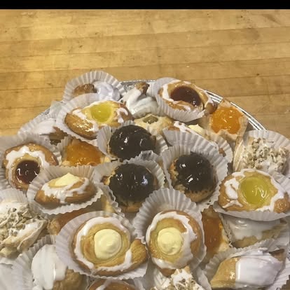 Tray of assorted Italian pastries with cream and jam