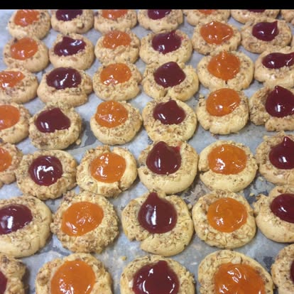 Jam thumbprint cookies on a baking tray