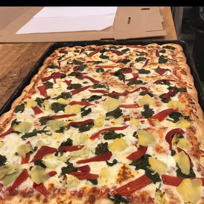 White sheet pizza with roasted peppers and spinach