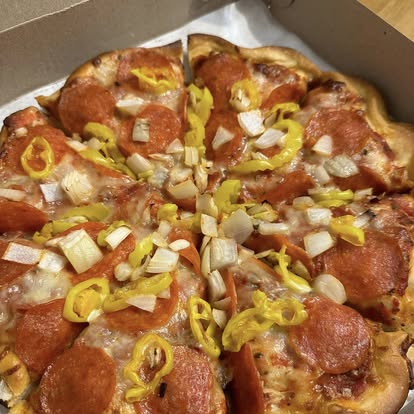 Pepperoni pizza with onion and banana peppers