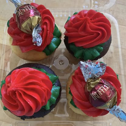 Chocolate cupcakes with red rose frosting