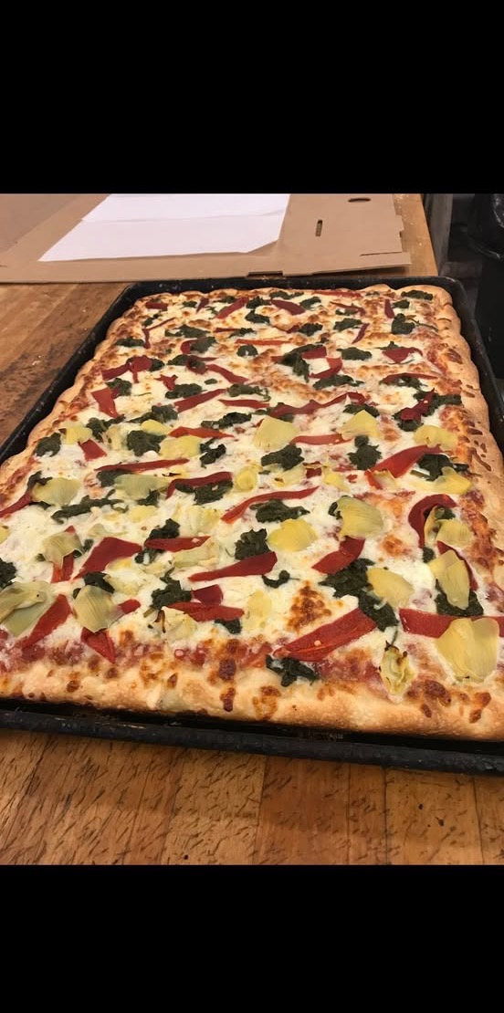 Sicilian sheet pizza with roasted peppers, spinach and artichoke